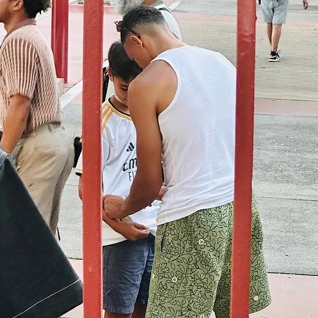 Trent Alexander-Arnold was spotted signing a young fan's Real Madrid shirt on holiday