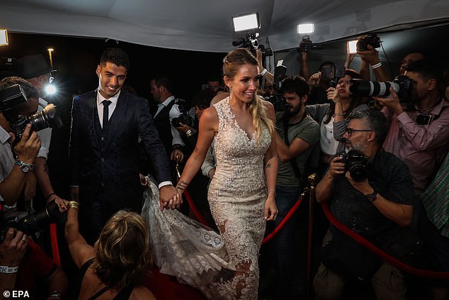 Wow: Sofia looked sensational for her wedding ceremony in a white figure-hugging jewel-encrusted gown with a long sheer patterned train