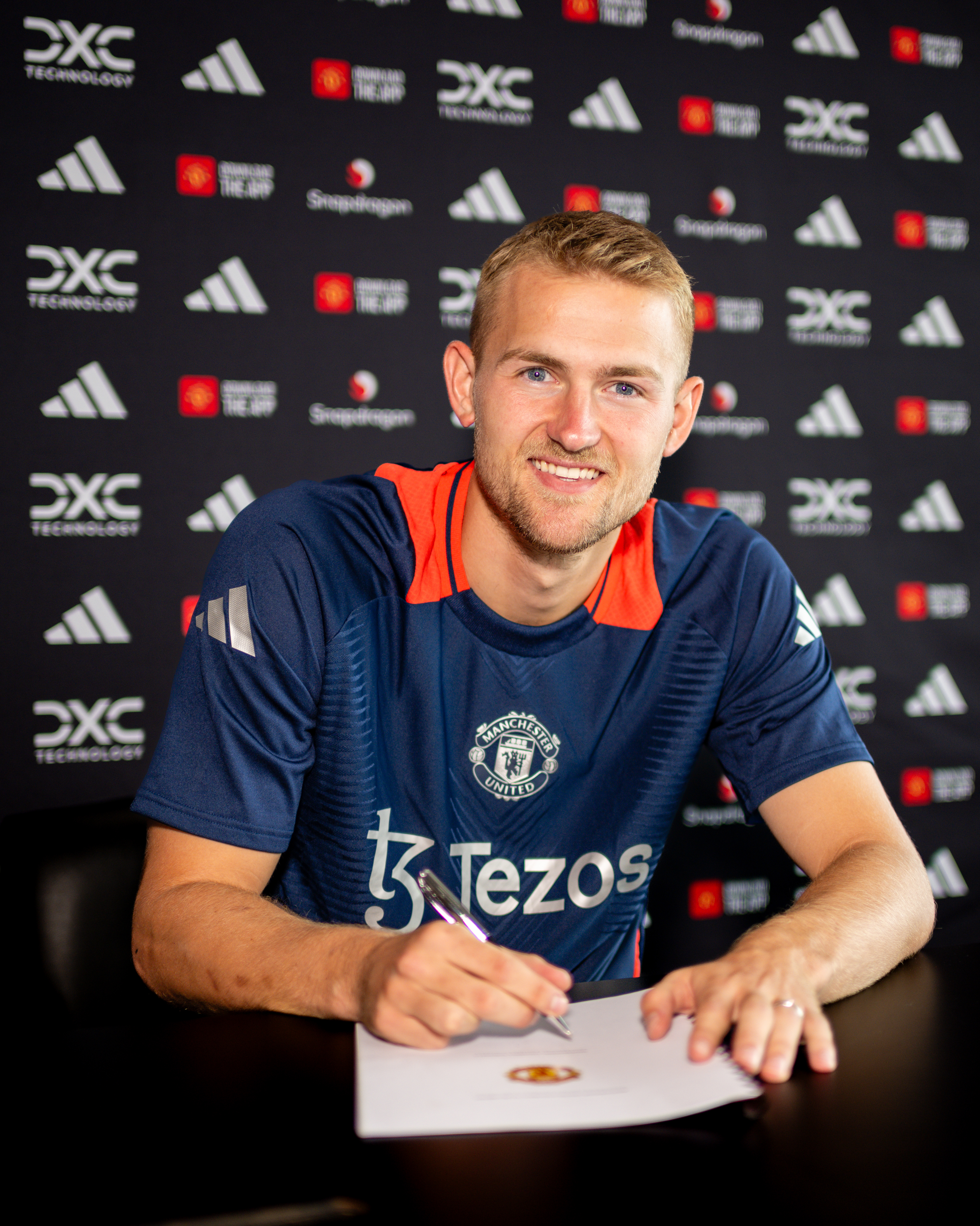 The club released pictures of him signing his contract