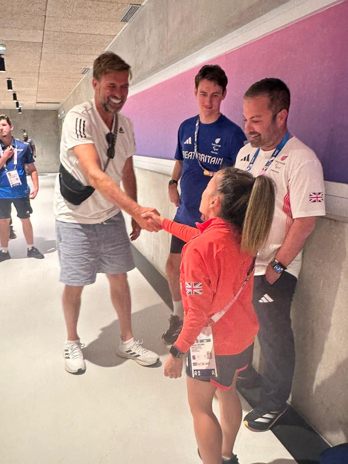 Klopp shaking hands with Rachel, really smiling