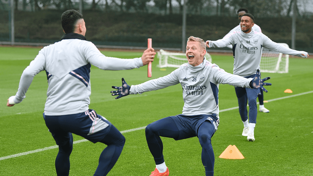 Oleksandr Zinchenko celebrates with Gabriel Martinelli in training