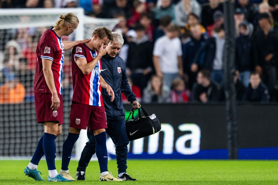 Odegaard had to be helped off the pitch by Erling Haaland