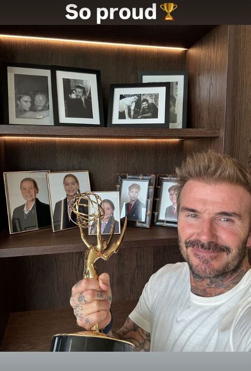 The 49-year-old posed with the award in front of some incredible throwbacks of his family