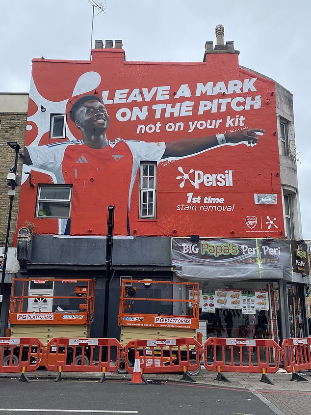 A new Bukayo Saka mural on a north London fried chicken shop is shown off in Highbury and Islington