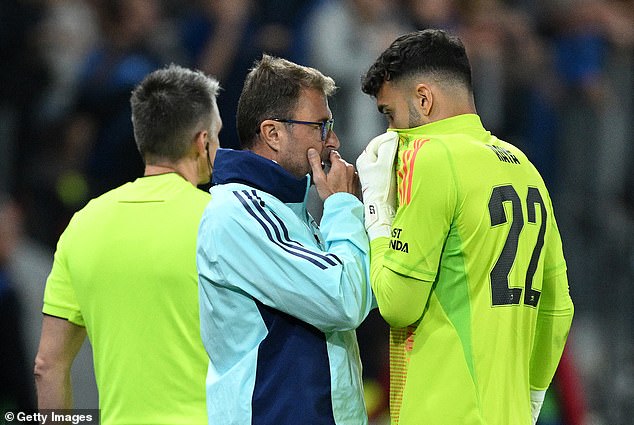 David Raya was seen in conversation with Arsenal's goalkeeping coach Inaki Cana (left) before his penalty save