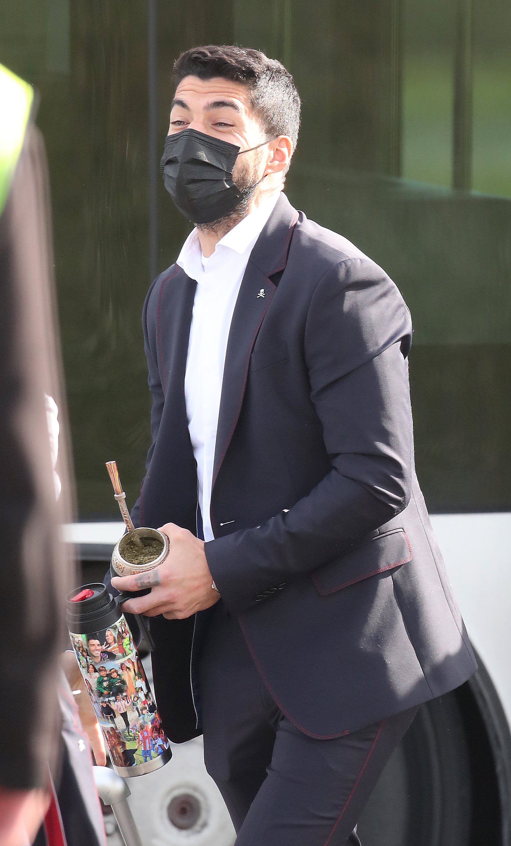 He looked classy in the sharp suit and carrying the lovely bottle - as well as some mate tea