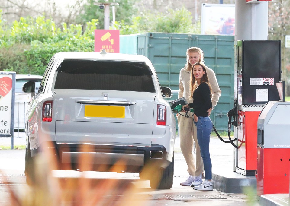 Erling Haaland lets his hair down as girlfriend Isabel fills up their  £300,000 Rolls Royce at petrol station | The Sun